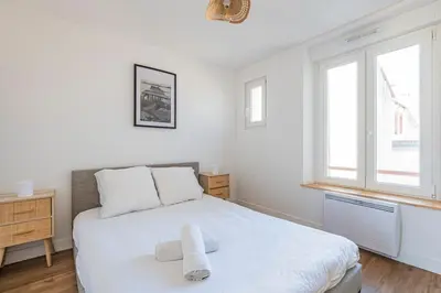 Un ou plusieurs lits dans un hébergement de l'établissement Charmant appartement - 4 personnes
