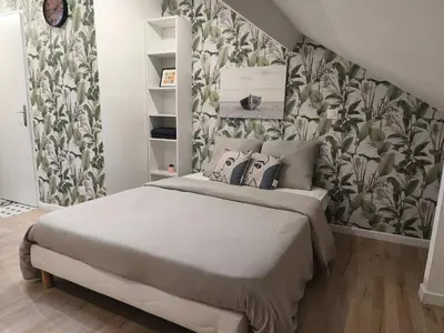 Un ou plusieurs lits dans un hébergement de l'établissement Studio confortable avec parking