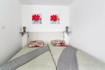 Un ou plusieurs lits dans un hébergement de l'établissement Gîte de la Manufacture - Studio St-Gobain