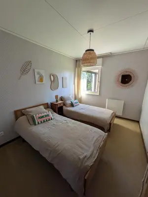 Un ou plusieurs lits dans un hébergement de l'établissement Maison de location