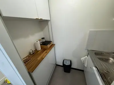 Cuisine ou kitchenette dans l'établissement Studio moderne et sécurisé