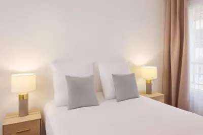 Un ou plusieurs lits dans un hébergement de l'établissement Quality Aparthotel Meaux