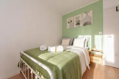 Un ou plusieurs lits dans un hébergement de l'établissement Aceta Home Saint-Quentin - Appartement Jardin Sauge