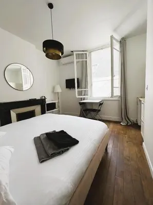 Un ou plusieurs lits dans un hébergement de l'établissement PINK - Cosy studio au cœur de Reims