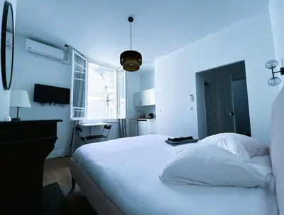 Un ou plusieurs lits dans un hébergement de l'établissement PINK - Cosy studio au cœur de Reims