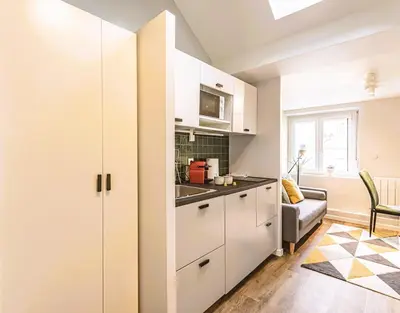 Cuisine ou kitchenette dans l'établissement L'arc en Ciel - Appartement paisible à proximité de la Cathédrale