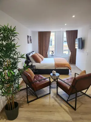 Un ou plusieurs lits dans un hébergement de l'établissement Suite R&B avec Terrasse -5 mins gare - Rue calme dans centre ville