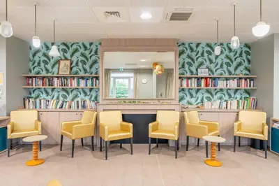Coin salon dans l'établissement Quality Aparthotel Reims - Les Capucins