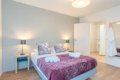 Un ou plusieurs lits dans un hébergement de l'établissement Quality Aparthotel Reims - Les Capucins