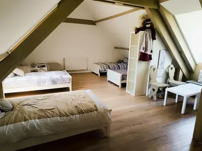 Un ou plusieurs lits dans un hébergement de l'établissement Gîte cottage Domaine La Boilière