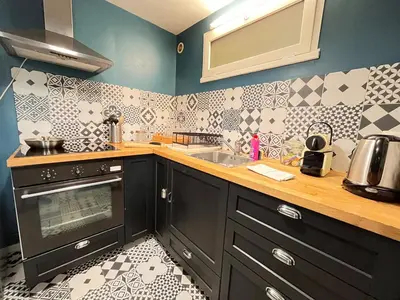 Cuisine ou kitchenette dans l'établissement E - La bulle de champagne T3 proche centre-ville