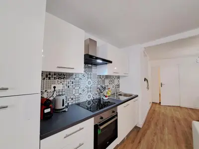 Cuisine ou kitchenette dans l'établissement Turin - Charme et confort au cœur de Reims