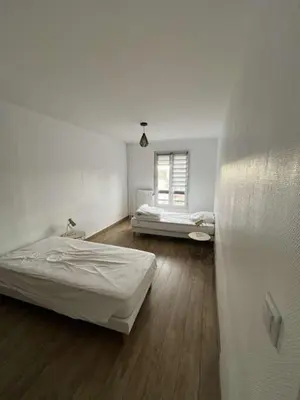Un ou plusieurs lits dans un hébergement de l'établissement Appartement spacieux 4 personnes sixième