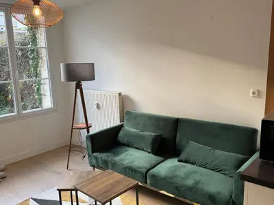 Coin salon dans l'établissement Appartement lumineux et moderne proche gare