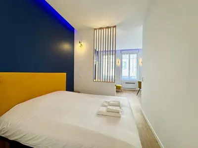 Un ou plusieurs lits dans un hébergement de l'établissement Wellness Suite Ponsardin 1 - Reims Centre