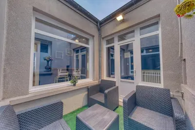 Coin salon dans l'établissement Suite & Spa - Jacuzzi - Sauna