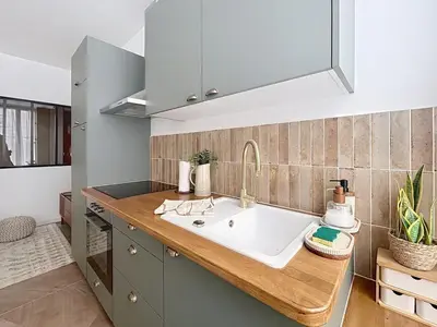 Cuisine ou kitchenette dans l'établissement Le Sienna - Centre ville et gare