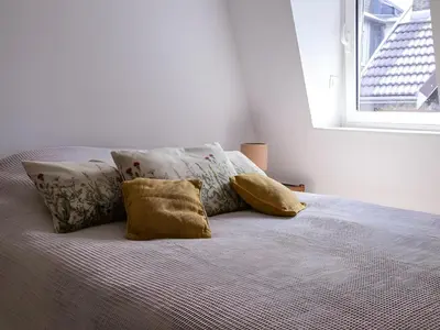 Un ou plusieurs lits dans un hébergement de l'établissement Spacieux duplex design - Reims centre