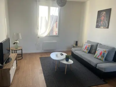 Coin salon dans l'établissement Appartement neuf et cosy