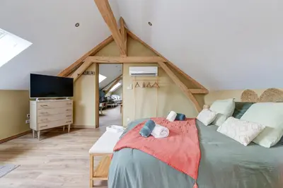 Un ou plusieurs lits dans un hébergement de l'établissement L'atelier de Théo - Bain nordique Privé