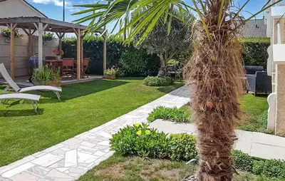 Jardin de l'établissement Charmante Maison À La Campagne