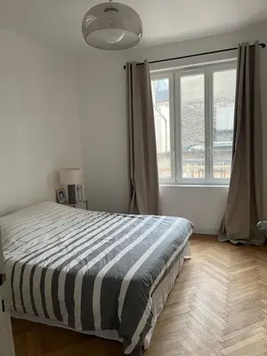Un ou plusieurs lits dans un hébergement de l'établissement Appartement de charme au forum