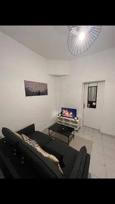 Coin salon dans l'établissement Saint Quentin city center apartment