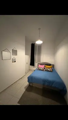 Un ou plusieurs lits dans un hébergement de l'établissement Saint Quentin city center apartment