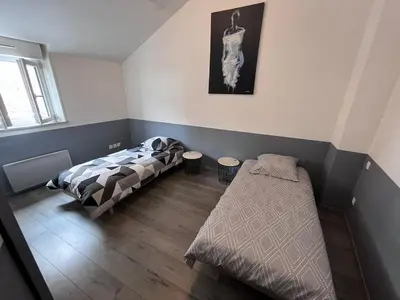 Un ou plusieurs lits dans un hébergement de l'établissement Logement au coeur de Roye