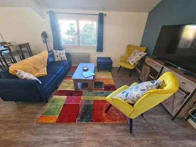 Coin salon dans l'établissement Longère au coeur de Reims complètement rénovée