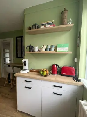 Cuisine ou kitchenette dans l'établissement Joli appartement secteur Mézières