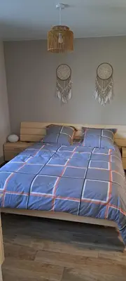 Un ou plusieurs lits dans un hébergement de l'établissement Maison Au 14