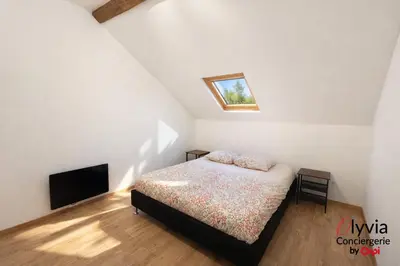 Un ou plusieurs lits dans un hébergement de l'établissement Appartement Vue Cathédrale