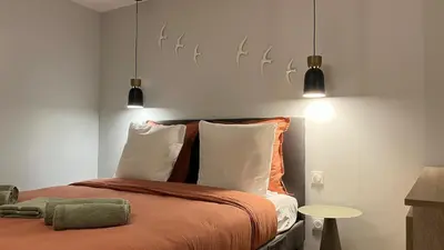 Un ou plusieurs lits dans un hébergement de l'établissement Le Triplex Chic & Choc - Disneyland Paris