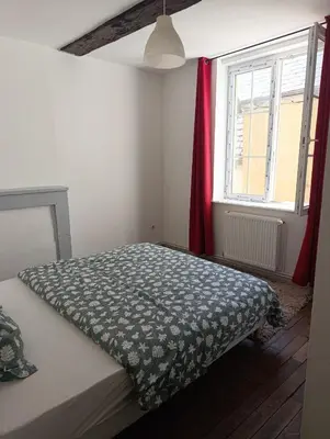 Un ou plusieurs lits dans un hébergement de l'établissement Appartement Cosy du château