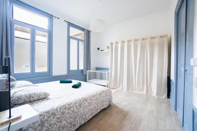 Un ou plusieurs lits dans un hébergement de l'établissement Le Bobo Rémois - Center - Cathedral