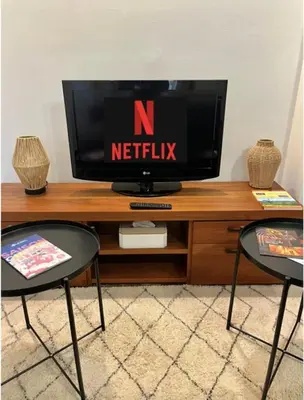 Télévision ou salle de divertissement dans l'établissement La vue sacrée