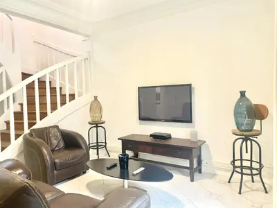 Télévision ou salle de divertissement dans l'établissement Maison Villa Foch