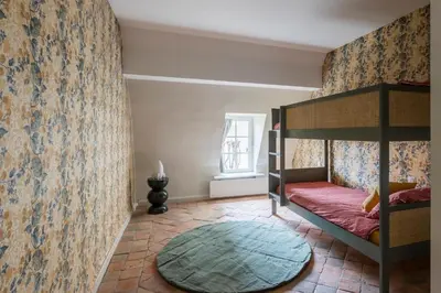Un ou plusieurs lits dans un hébergement de l'établissement Manoir de la Marquise