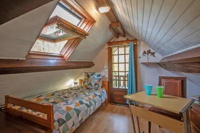 Un ou plusieurs lits dans un hébergement de l'établissement Au Chemin de la Forêt - Maison pour 4p