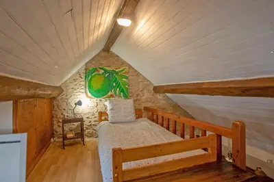 Un ou plusieurs lits dans un hébergement de l'établissement Au Chemin de la Forêt - Maison pour 4p