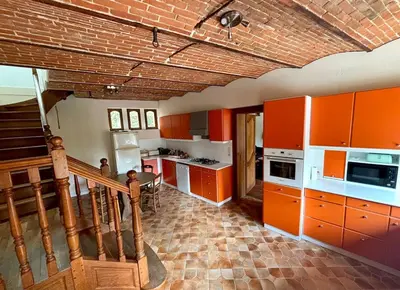 Cuisine ou kitchenette dans l'établissement Gîte Chez Tio Père - 12 personnes