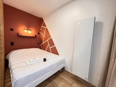 Un ou plusieurs lits dans un hébergement de l'établissement Paris 21 - Studio charmant proche du centre-ville