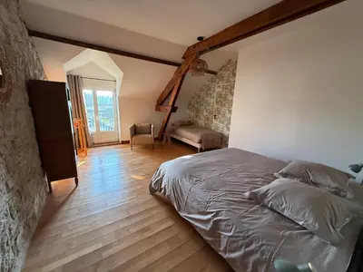 Un ou plusieurs lits dans un hébergement de l'établissement Gîte Chez Maurice