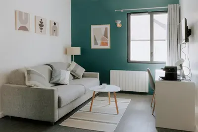 Coin salon dans l'établissement Immi Immobilier - Studio Cozy & Équipé