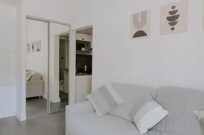 Coin salon dans l'établissement Immi Immobilier - Studio Cozy & Équipé