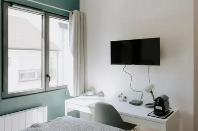 Télévision ou salle de divertissement dans l'établissement Immi Immobilier - Studio Cozy & Équipé