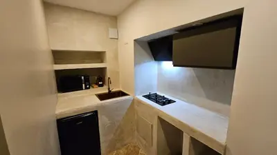 Cuisine ou kitchenette dans l'établissement La suite Frêne