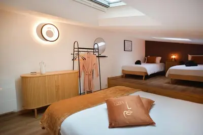Un ou plusieurs lits dans un hébergement de l'établissement Une pause rémoise cocooning au centre ville