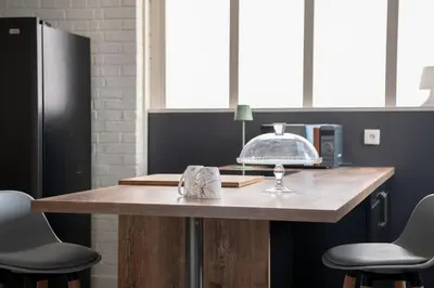 Cuisine ou kitchenette dans l'établissement Le Saint-Quentin - Studio avec Terrasse